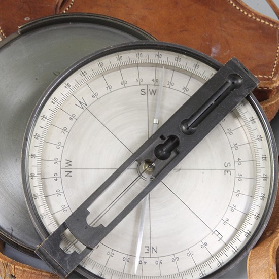 A leather cased compass, by T Cooke and Sons, London, New York and Capetown